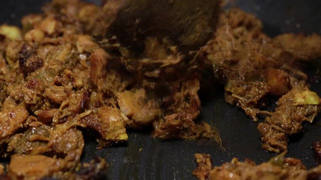 South Indian dish spicy beef fry Kerala, India. side dish ghee rice, appam, parotta, puttu, bread and chappathi, Kerala cuisine ,Buffalo roast / Meat pepper fry with coconut. India spices cooking,