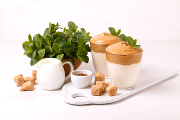 whipped dalgona coffee with milk and cane sugar. South Korean summer drink