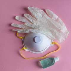 cover 19 set to go out  mask for face gloves and gel for hands on pink background