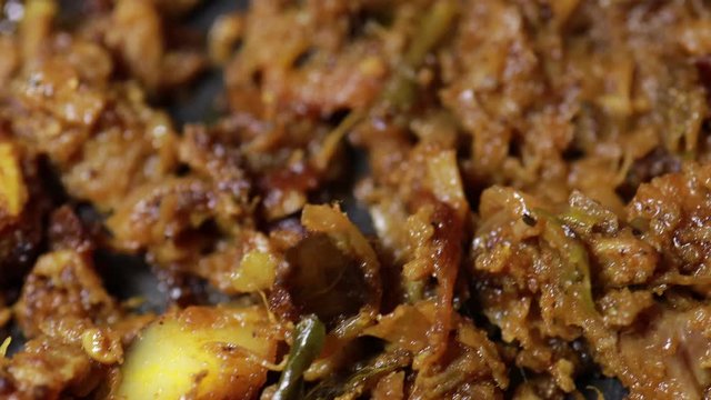 South Indian dish spicy beef fry Kerala, India. side dish ghee rice, appam, parotta, puttu, bread and chappathi, Kerala cuisine ,Buffalo roast / Meat pepper fry with coconut. India spices cooking,