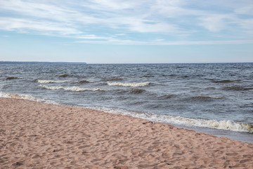 Fototapeta na wymiar View of the sandy beach of the sea. Ladoga Lake Russia.