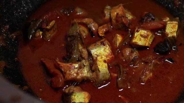 Meen Vattichathu or Pattichathu, sardine fish cooked. Traditional hot and spicy fish curry Kerala India with dried red chilly and green curry leafs. Very popular coastal food eat with tapioca or rice
