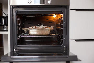 Fragrant and crunchy bread in the oven in the kitchen. Homemade fresh bread without yeast.