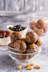 Fruit and nut energy balls in a bowl, front view.