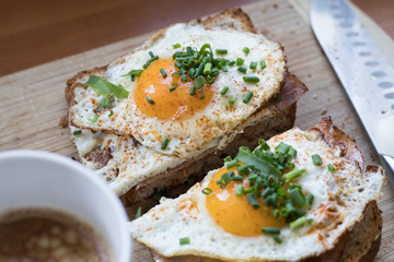 Sandwich with fried egg and chives, top view