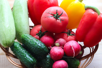Fresh vegetables. Cucumbers, radishes, tomato, green onions, zucchini, bell peppers. Healthy food concept. Top view. Vegetarian and organic food. Harvest.
