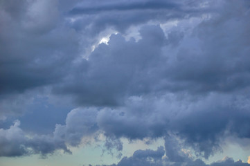 Rain clouds in the sunset sky.