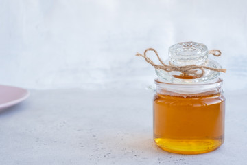 Composition with fresh honey on maroon background