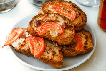 toast sliced bread with cheddar  tomato and egg