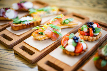 Salty ecler with fresh salmon on top and cheese