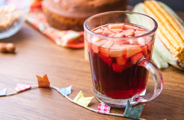Hot mulled wine from Brazil with apple pieces, tipical in Festa Junina Festival. Traditional food...