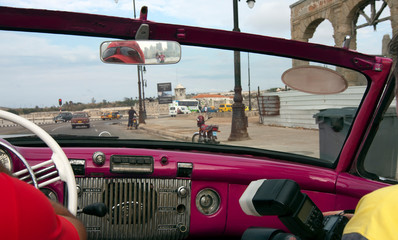 view from old convertible car on the promenadein Havana, Cuba..