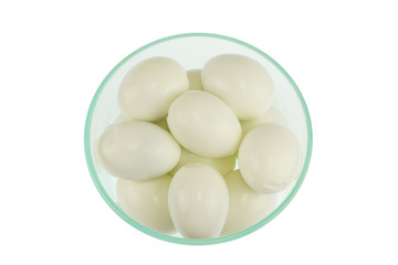 close up on boiled egg in glass bowl isolated on white background