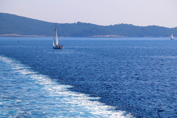 Sailing boat on the sea in southern Dalmatia region in Croatia. Beautiful landscape and bright...