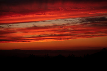 City sunset and red clouds. Sunset.