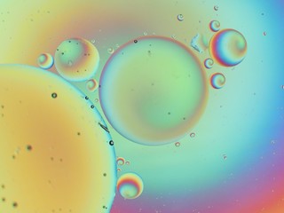 Oil and water macro abstract background with bubbles