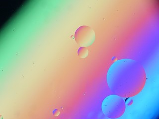 Oil and water macro abstract background with bubbles