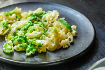 pasta creste di galli green sauce mint pesto Menu concept healthy eating. food background top view copy space for text healthy eating table setting