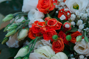 Wedding rings on flowers