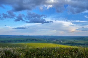 Steppes and distant green hills in the rain. Zabaykalsky Krai. Russia.