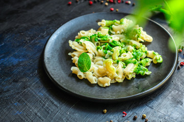 pasta creste di galli green sauce mint pesto Menu concept healthy eating. food background top view copy space for text healthy eating table setting