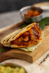 Pork arepa with blur on the back