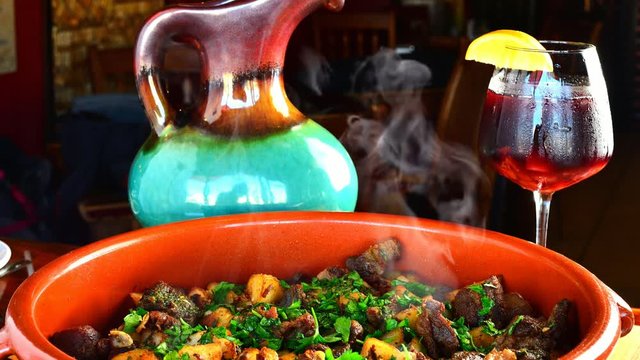 Castellana casserole made with chicken, pork sausage, garbanzos, potatoes, artichokes, peppers, olives and alioli 