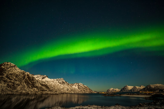 Dramatic polar lights, Aurora borealis over the mountains in the North of Europe - Lofoten islands, Nature of Norway © Tatiana