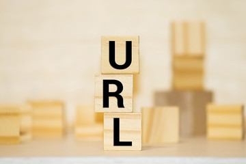 Letters abbreviation url www on wooden cubes, on a dark background, light wooden cubes signs,...