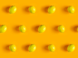 Citrus backdrop. Juicy ripe lemon  pattern on yellow background top.