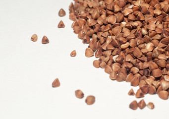 Buckwheat grains on a white background