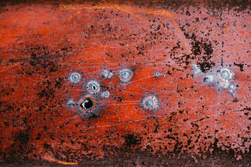 old metallic red rusty surface background. Selective focus macro shot with shallow DOF