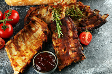 Grilled spare ribs for a tasty bbq meat with hot spicy barbecue sauce