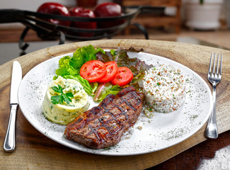 Grilled meat with trimmings