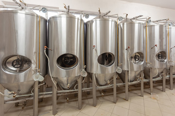 Brewery, beer tanks are covered with drops of water
