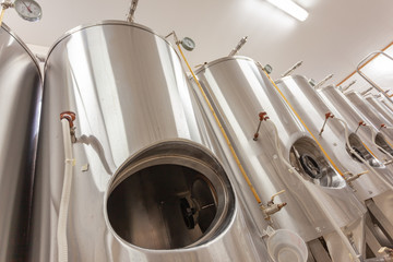 Brewery, open beer tank, bottom view. Cylindroconic fermentation tanks.