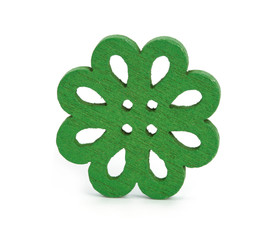 Wooden curly button with two holes on a white background.