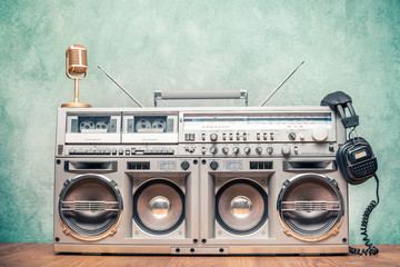 Retro old ghetto blaster stereo radio cassette tape recorder boombox from circa 80s, golden...