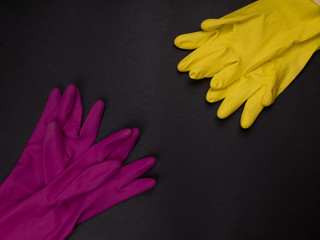 color rubber gloves for cleaning on color background, workhouse concept.  General or regular...