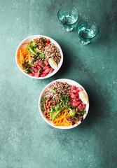 Vercion of Hawaiian tuna poke bowl with quinoa. tropical background