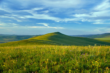 Green steppes and hills on a summer day. Zabaykalsky Krai. Russia.