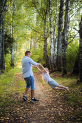 A Father and son in forest on a meadow