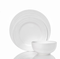 Whitw plates and bowl isolated on white