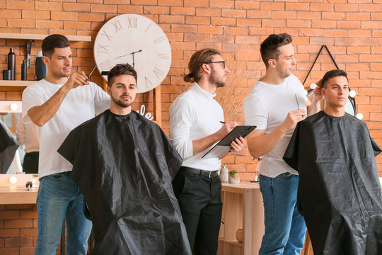 Young men during professional courses in hairdresser's salon