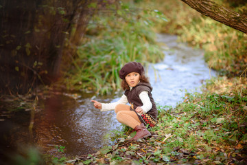 Fototapeta premium Happy Little Girl playing in the river.