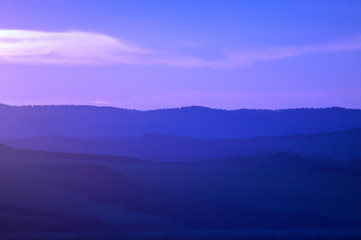 Distant hills over the steppe at sunset. Zabaykalsky Krai. Russia.