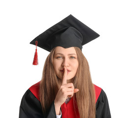 Female graduating student showing silence gesture on white background