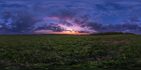 full seamless spherical hdri panorama 360 degrees angle view among fields in summer evening sunset with awesome blue pink red clouds in equirectangular projection, ready for VR AR virtual reality