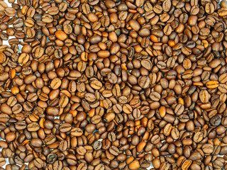 Roasted brown coffee beans, can be used as a background and texture
