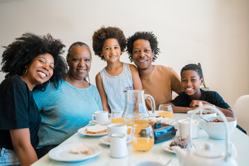 Obraz premium Family having breakfast together at home.